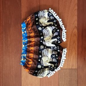NWOT Black/white/orange/blue elephant shorts with pom-pom hems. Size S.